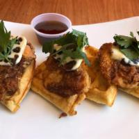 Fried Chicken & Waffles · Fried buttermilk chicken on a brussels-style waffle. Served with date butter and syrup.