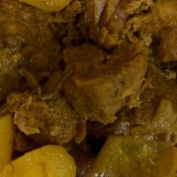 Curry Goat · A traditional Jamaican dish in which goat meat is infused with flavors of curry powder, chop...