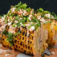 Mexican Street Corn · Grilled corn on the cob, drizzled sriracha mayo, queso fresco, cilantro, dusted with tajin.
...