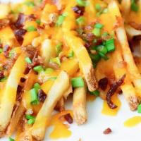 Bacon Cheese Fries · French fries topped with melted cheese, bacon bits, scallions,