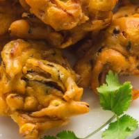 Onion Bhaji · Vegan, gluten free. Shredded onions marinated with spices and gram flour, then deep fried.