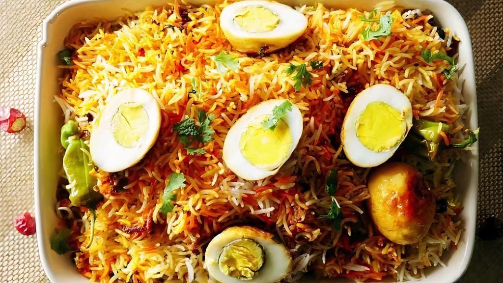Egg Biryani · Gluten free. 3 boiled eggs cooked with basmati rice, yogurt, spices, herbs and flavored with saffron.