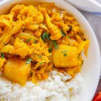 Aloo Gobi · Vegan, gluten free. Potatoes and cauliflower cooked with Indian spice, garlic, ginger and fr...
