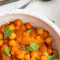 Chana Masala · Vegan, gluten free. Chickpeas cooked with tomatoes, onions, ginger and in an exotic blend of...