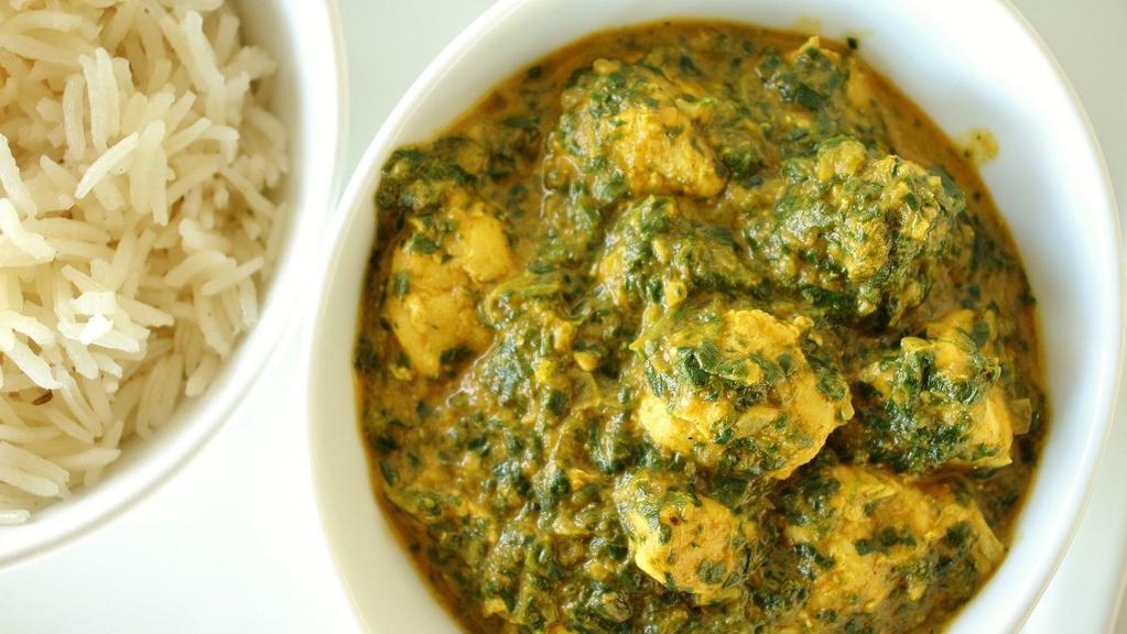 Chicken Saag · Gluten free. A medium spiced dish cooked with spinach and chicken spices, coriander and garnished with fresh lemon.