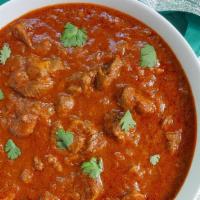 Lamb Rogan Josh · Gluten free. Tender piece of lamb cooked in tomatoes sauce and garlic ginger paste and fresh...