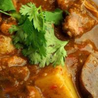Lamb Vindaloo · Gluten free. Lamb cooked with vinegar hot pepper, lots of fresh herbs and spice and the chef...