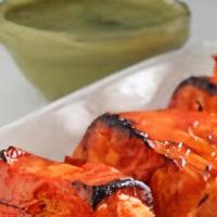 Fish Tikka (Salmon) · Gluten free. Fish marinated in tandoor sauce made of yogurt, garlic, ginger and tandoor spice.