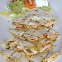 Quesadillas · Served w/ lettuce, pico de gallo, sour cream, guacamole & cheese. Your choice of grilled chi...