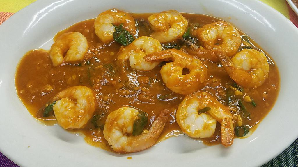Camarones Al Ajillo · Sauteed shrimp in garlic tomato sauce & spinach