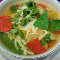 Sopa De Tortilla · Crispy corn tortilla chips w/ chicken, vegetables, cheese, avocado & cilantro