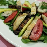 Rivera Maya Salad · Grilled chicken, portobello mushrooms, avocado & roasted peppers over spinach romaine salad ...