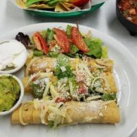 Flautas Nortenas (3) · South of the border crispy rolled corn tortillas w/ chicken or beef topped w/ shredded lettu...