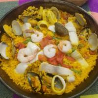 Paella Marinera (Seafood) · Clams, shrimp, mussels, calamari & tilapia in yellow rice. Add Chorizo and Chicken (Mexico C...