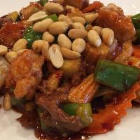 Kung Pao Three Delight · Spicy. Beef, chicken, and pork, stir-fried with carrots, onions, green onions, green and red...