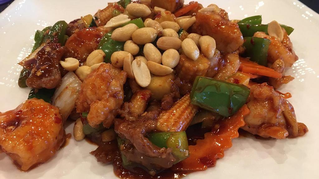 Kung Pao Three Delight · Spicy. Beef, chicken, and pork, stir-fried with carrots, onions, green onions, green and red peppers, in a spicy brown sauce. Served with steamed or fried rice.