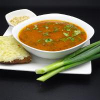 Kharcho · Spicy tomato based lamb soup with rice.