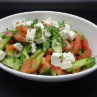 Darnitsky Salad · Tomato, cucumber, onion, feta, cilantro, parsley, dill, and house vinaigrette.