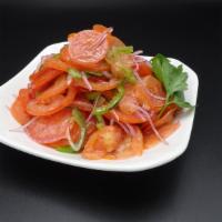 Achichuk Salad · Thin sliced tomato with onion and jalapeño pepper.