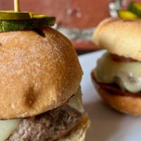 Cuban Cheeseburger Sliders · Mojo Marinated beef and pork burgers, topped with Virginia ham, Swiss cheese and dijonnaise