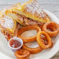 Monte Cristo Sandwich* · Thick slices of homemade brioche bread dipped in egg batter pan-fried to golden brown with t...