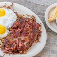 Homemade Corned Beef Hash* · Home made corned beef hash with sautéed onions and bell peppers, served with two eggs and ho...