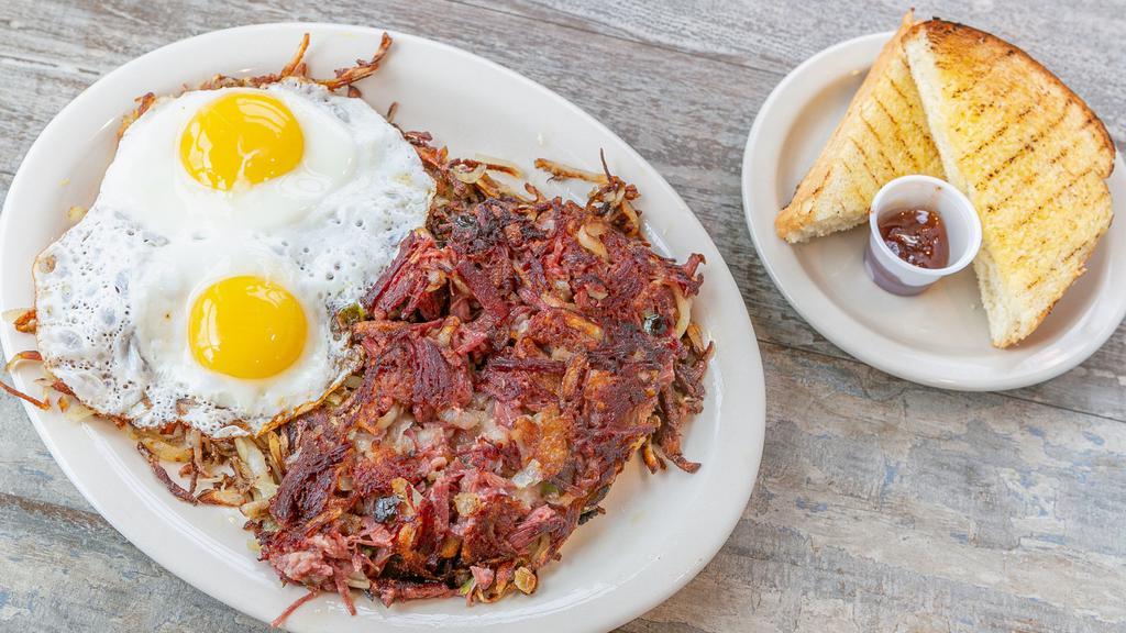 Homemade Corned Beef Hash* · Home made corned beef hash with sautéed onions and bell peppers, served with two eggs and homemade toast.