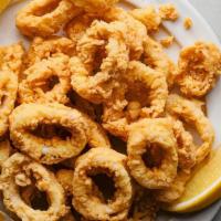 Traditional Calamari · Tender lightly battered fried calamari, with a side of marinara.