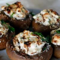 Stuffed Mushrooms · Baked with sweet sausage, vegetables, breadcrumbs, and herbs, featured in a delicate tomato ...