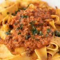 Bolognese · Ground tender veal sautéed with onions, garlic, white wine, finished with a creamy tomato sa...