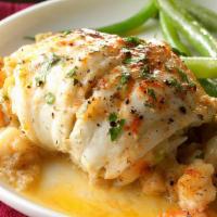 Stuffed Flounder · Sweet white fish rolled with a crabmeat stuffing and baked in a lemon butter sauce.