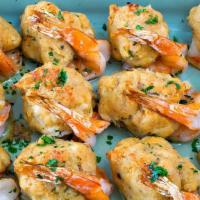 Stuffed Shrimp · With crabmeat, breadcrumbs, onions, and herbs. Finished with lemon butter.