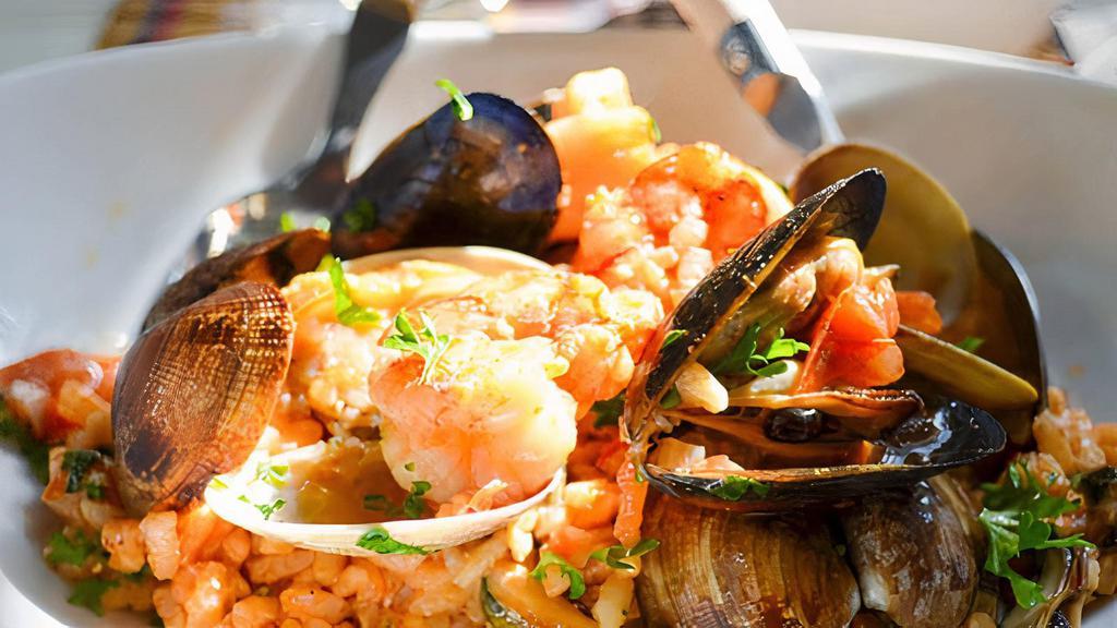 Seafood Panela · Mussels, clams, calamari, shrimp sautéed in your choice of sweet marinara or spicy fra diavolo tomato sauce served in a homemade Italian bread bowl.