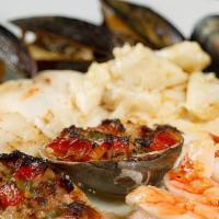 Broiled Seafood Combination · Clams oreganata, stuffed shrimp, crab-filled sole, and broiled salmon finished with white wi...