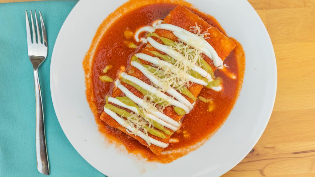 Burrito · Rice, Beans , Cilantro, Onion,  and Meat Wrapped in Flour Tortillas
