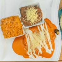 Chile Relleno Plate · Chile relleno covered with chipotle sauce. Served with a side of rice, beans & three handmad...