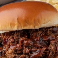 Beef Brisket Sandwich Combo · Slow-Smoked Beef Brisket piled and topped with our BBQ sauce. Served with 1 side and 1 drink