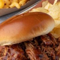 Pulled Chicken Sandwich Combo · Our BBQ Chicken slow-smoked, pulled and tossed in our BBQ Sauce. Served with 1 side and 1 dr...