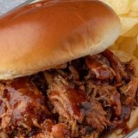 Pulled Chicken Sandwich · Our slow-smoked BBQ Chicken, pulled and tossed in our BBQ Sauce. Served with potato chips