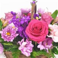 Spring Basket 2 · A lovely mixed flower arrangement, in a wicker basket.
This flower arrangement contains: Hot...