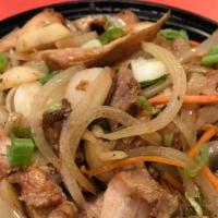 Dragon Chicken Bowl · White meat chicken, green peppers, onion and carrots with a spicy soy-sesame sauce over whit...