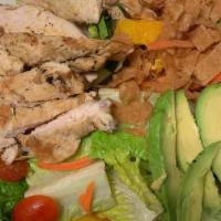 Asian Chicken Salad · Grilled chicken, lettuce, crunchy noodles, fresh orange, cucumber, avocado, carrot, cherry t...