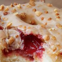 Pb&J · Yeast doughnut with peanut butter glaze, strawberry jam filling, topped with chopped peanuts
