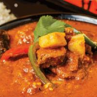 Vindaloo (Gf) · Tangy onion and tomato sauce sauteed with bell peppers & potatoes, finished with tamarind ch...