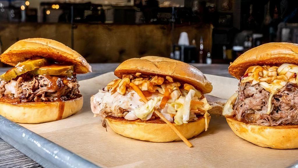 Slab Slider Trio · 3 of our most popular sammiches in a smaller size served on slider buns. Comes with Notorious P.I.G., TX O.G. and Chicken.W.A. *Extra charge for substitutions.