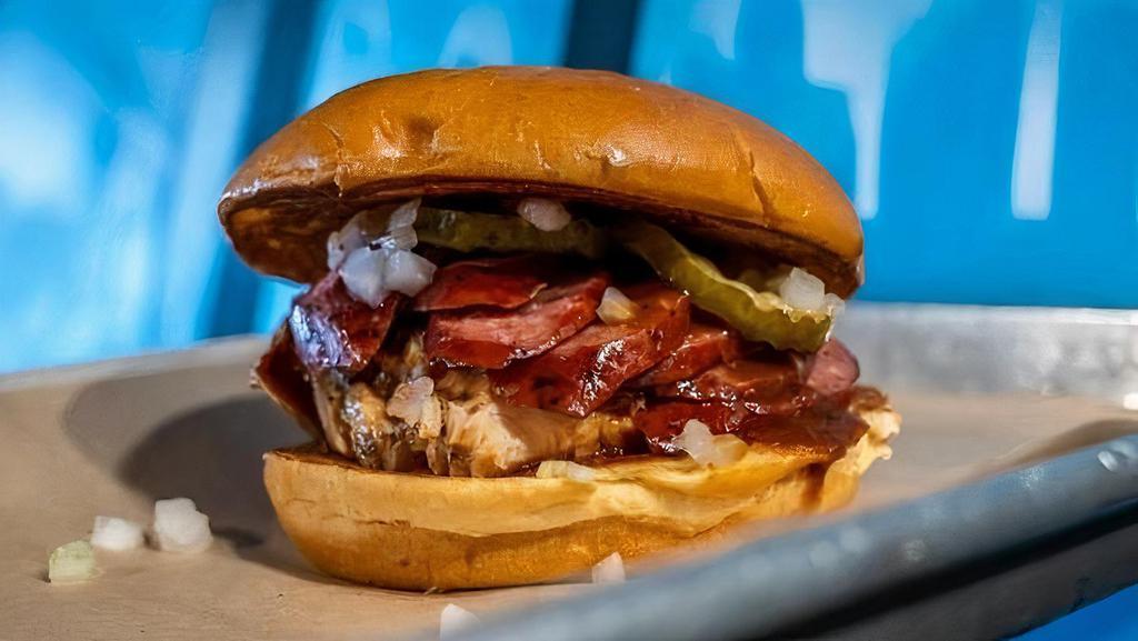 Pork Two Step · Pulled pork topped with sausage, pickles, onions & your choice of BBQ sauce.