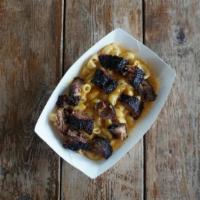 Daddy Mac · Boat of Smoked Cheddar and Gouda Mac n Cheese topped with your choice of meat