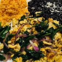 Huevos And Spinach. · Scrambled eggs sautéed with spinach, bell peppers, and red onion. Served with rice, beans, a...