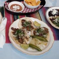 Tacos (1). · Soft corn tortilla filled with your choice of meat (asada, carnitas, chorizo, chicken or pas...