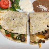 Veggie Quesadilla. · Large flour tortilla with melted cheese and grilled
vegetables (mushrooms, spinach, red onio...